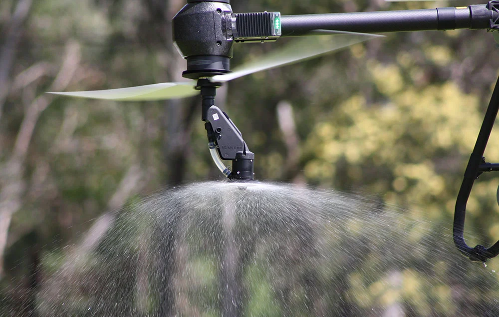 Agricultural spraying drone treating a paddock